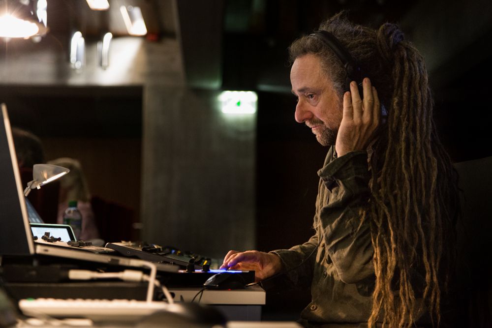 Markus Egloff mixing with headphones at a sound desk