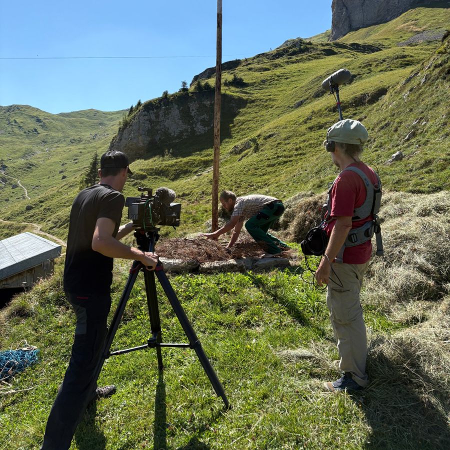 Markus Egloff with boom and recorder on a documentary shoot in the Swiss Alps